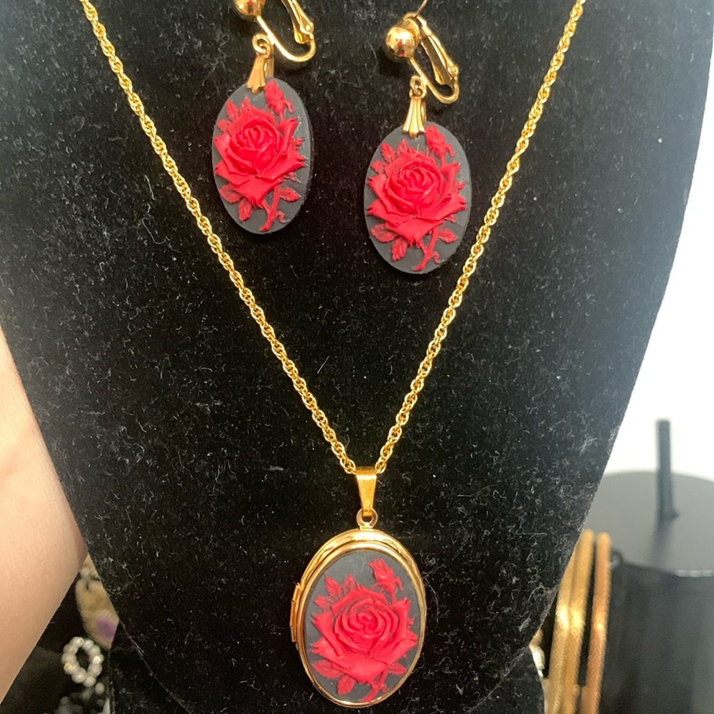 Rose on black base locket with matching earrings.